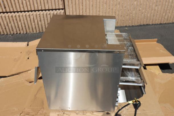 Brand new Vollrath JT4HC dual conveyor toaster, stainless steel, visible exterior scratches, on cardboard surface.