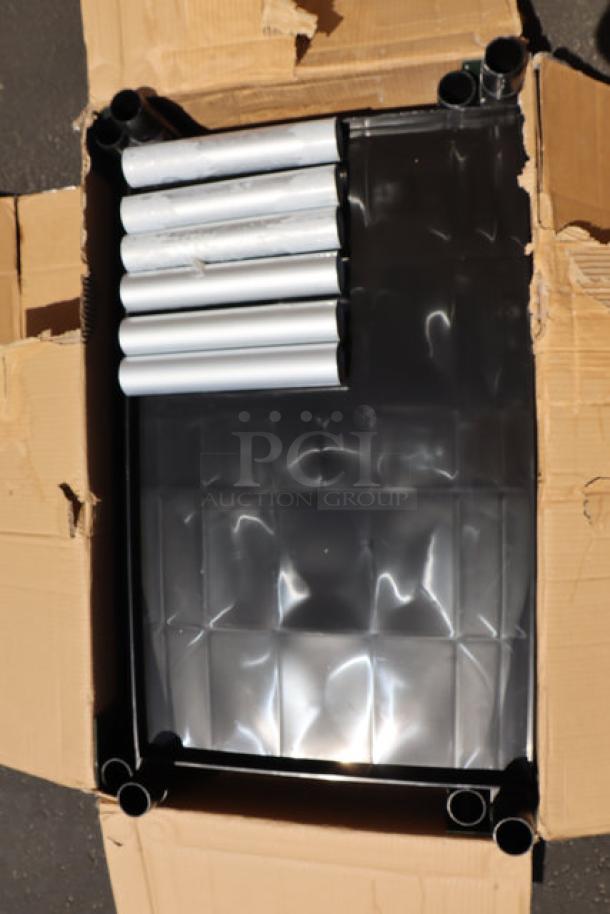 BRAND NEW CHOICE black utility cart with three shelves in original box. Model: UTILITY BUSSING CART. Slight scratches present.