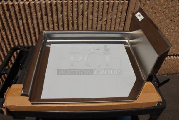 Brand new Regency 16 gauge 2' clean dish table with left drainboard. Scratch and dent condition, silver stainless steel finish.