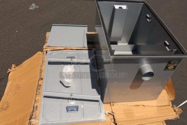 BRAND NEW Regency 35 GPM Grease Trap, model 600GT35, with 3" non-threaded connections, shown on cardboard. Scratch & dent condition.