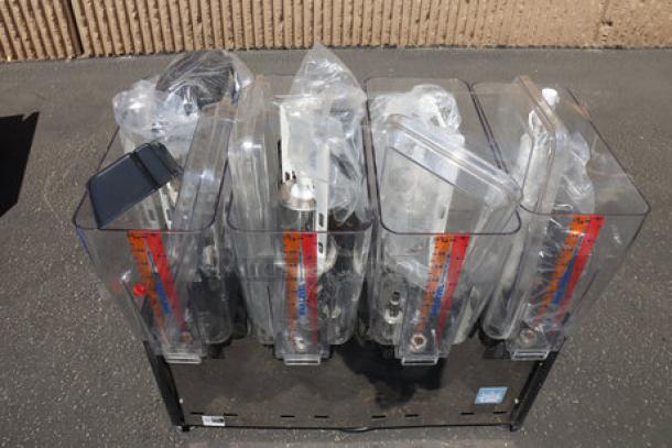 Brand new Carnival King RBD5G4 quadruple 5-gallon refrigerated beverage dispenser, minor scratches, 120V, clear bowls.