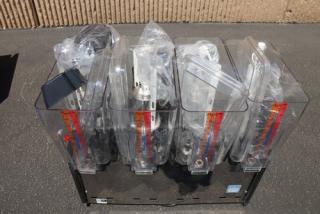Brand new Carnival King RBD5G4 quadruple 5-gallon refrigerated beverage dispenser, minor scratches, 120V, clear bowls.