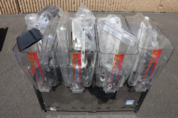 Carnival King RBD5G4 quadruple 5-gallon beverage dispenser, new, scratch & dent condition, transparent bowls, 120V.