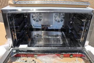 Brand new Avantco CO-46M full-size countertop convection oven with moisture injection, visible stainless interior, multiple racks.