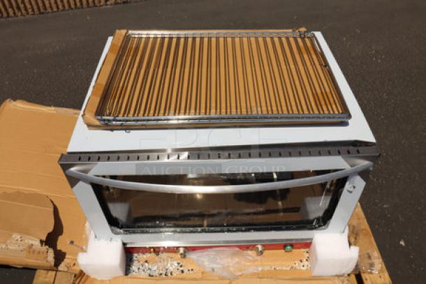 Brand new Avantco CO-46M convection oven, countertop model, moisture injection, 208/240V, minor scratches and dents visible.