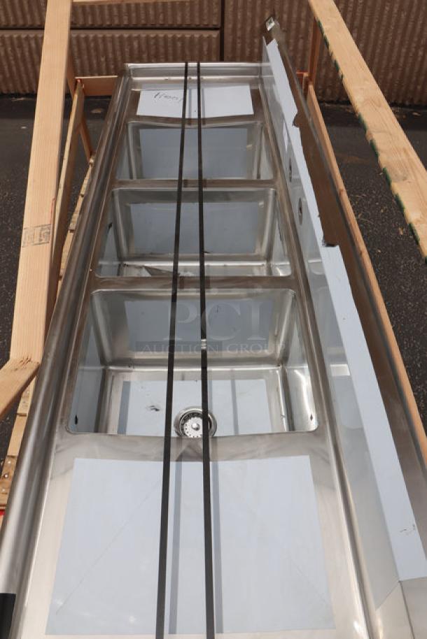 Regency 88" 16 gauge stainless steel three-compartment sink with dual drainboards, model 600S31620218, minor scratches and dents.