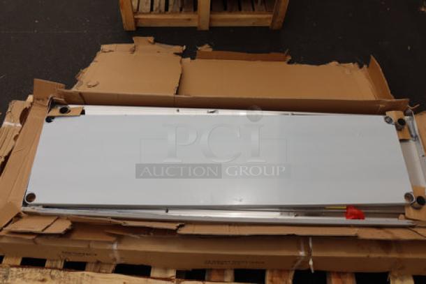 BRAND NEW Regency 600TSB2472S stainless steel work table, 24"x72", with 4" backsplash. Packaging damaged.