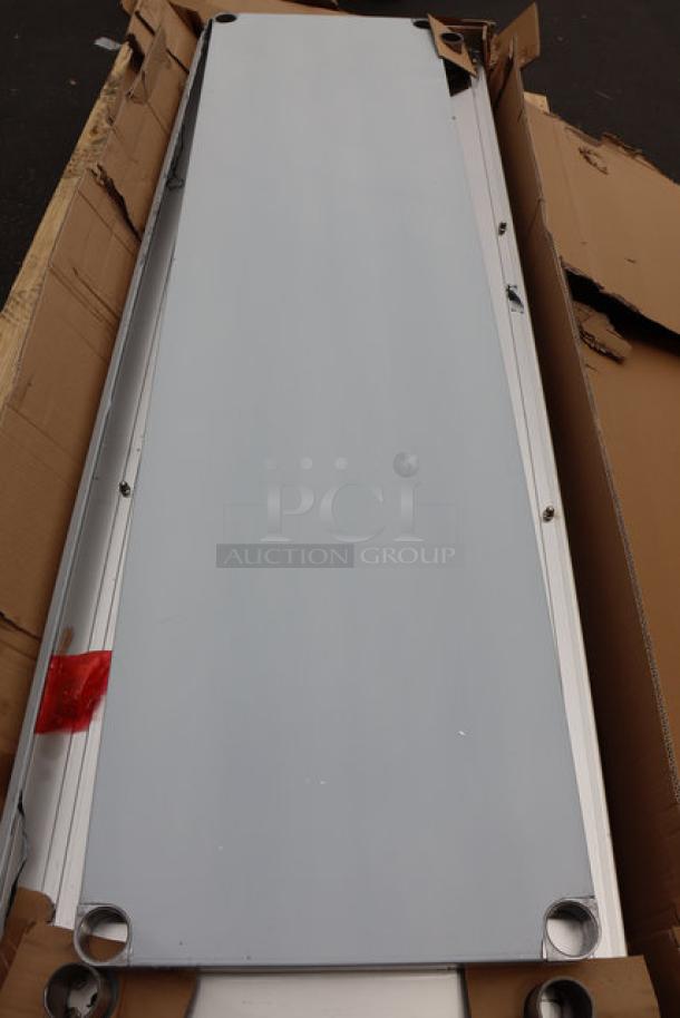 Brand new Regency 600TSB2472S stainless steel work table, 24" x 72", with 4" backsplash and undershelf. Packaging damaged.