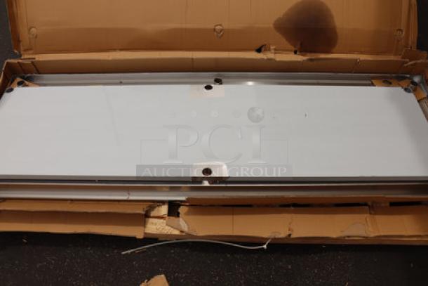 Regency 600TSB3096S 30" x 96" stainless steel work table with backsplash and undershelf. New, with scratches, dents, damaged packaging.
