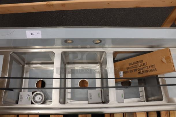 Regency 600S31416212 stainless steel three-compartment sink, 70", galvanized legs, with two drainboards. Minor dents/scratches possible.