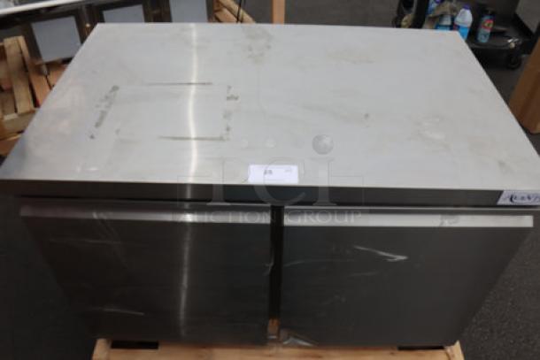 Avantco ZUC-48F-HC 48" undercounter freezer, scratched and dented, in working order. Model: ZUC-48F-HC, 115V, 4.5A, 300W.