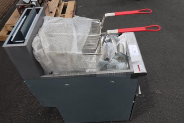 Brand new MainStreet Equipment 541FF40N stainless steel floor fryer, 40 lb. capacity, 90,000 BTU, with red-handled baskets.