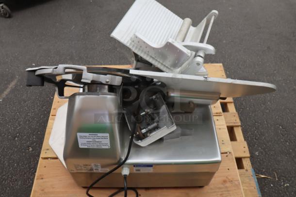 Estella SLA13 13" heavy-duty automatic meat slicer, new, no packaging. Features manual option, stainless steel body, 3/4 hp motor.