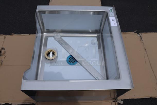 Regency 600SM242412N one compartment stainless steel mop sink with notched front, minor dent on backsplash, 24"x24"x12".