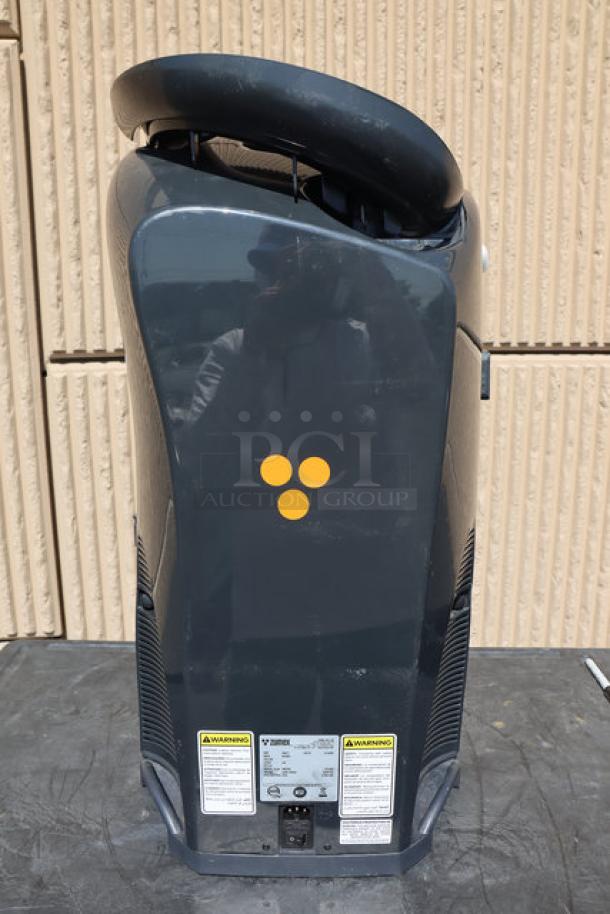 Zumex 04917 Dark Black Minex Compact Commercial Orange Juicer. Minor front panel damage, multitension 100-240V, 13 oranges/minute.