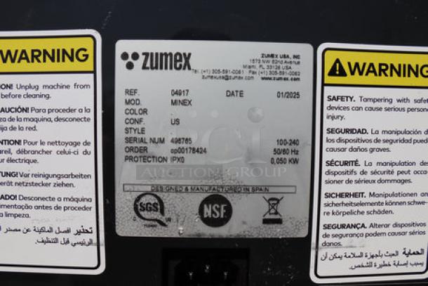 Zumex 04917 Dark Black Minex Orange Juicer label, model details, multitension 100-240V, minor front panel damage noted.