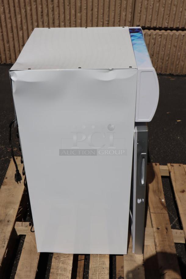 Brand new Avantco CFM2LB countertop freezer with dents, white, swing door, customizable top-lit header, 115V, tested working.