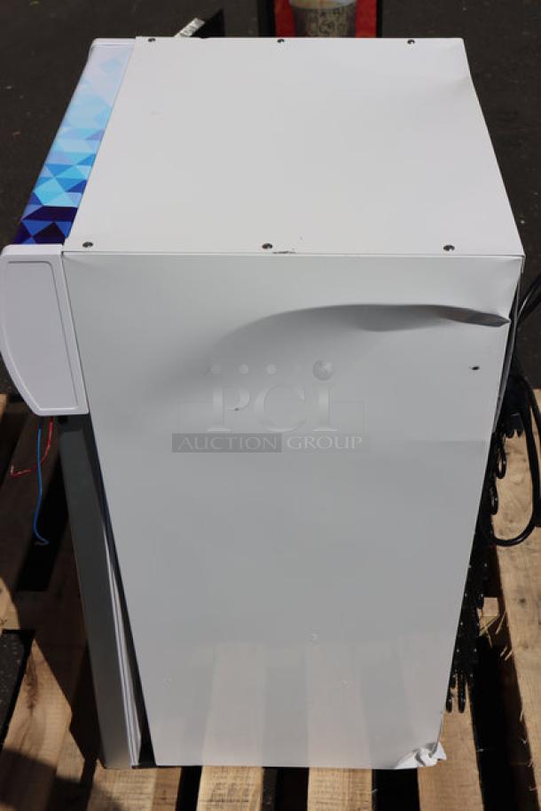 Brand new Avantco CFM2LB countertop freezer, white, with swing door, top-lit header, minor dents visible. 18 1/8"x19 7/16"x33 11/16".