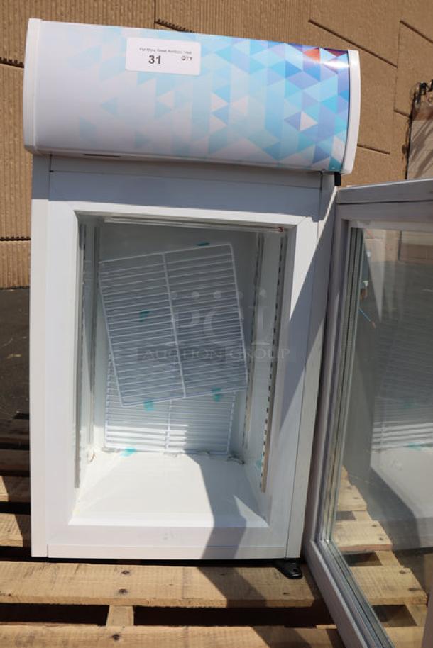 Brand new Avantco CFM2LB customizable countertop freezer with swing door and top lit header, 115V, white finish.
