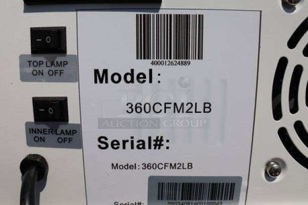 Avantco CFM2LB white countertop freezer, customizable, with swing door and top lit header; shown with model and serial labels.