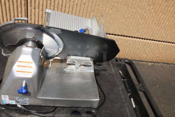 Brand new Vollrath 40951 12" meat slicer, medium duty, 2/5 hp, 120V, scratched surface, damaged sharpener support.