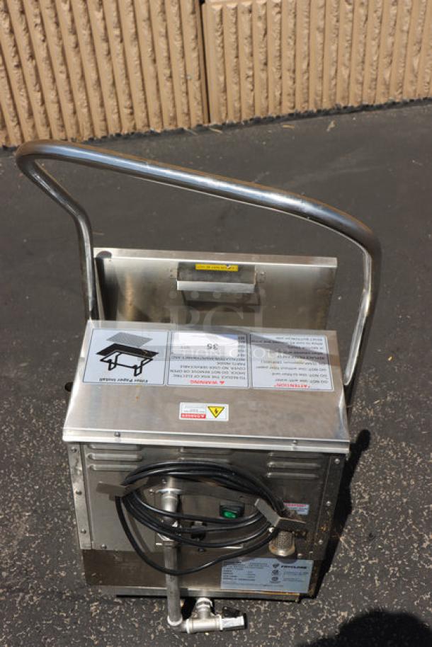 Brand new Fryclone 259OFM55 55 lb. fryer oil filter machine with 2-way pump, minor food grade oil spill visible.