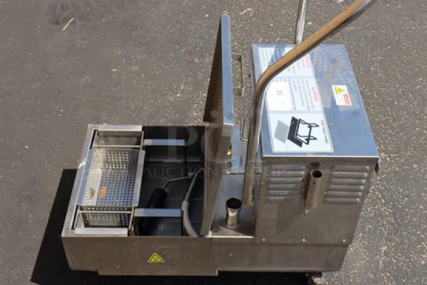 Fryclone 259OFM55 55 lb. fryer oil filter machine, stainless steel, portable, 2-way pump, slight food-grade oil spill.