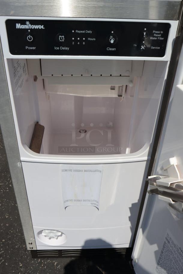 SCRATCH & DENT Manitowoc CrystalCraft Premier USE0050A-161 15" air-cooled undercounter square cube ice machine, 45 lb. capacity, 115v, open door view with control panel and interior.