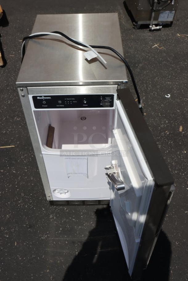 SCRATCH & DENT Manitowoc USE0050A-161 ice machine, 15" undercounter, 45 lb. capacity, air-cooled, open door view.
