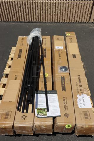 Brand new Lancaster Table & Seating 9' coal black umbrella, model 427UMFSR09BK. Includes black steel frame, boxes, and manual.