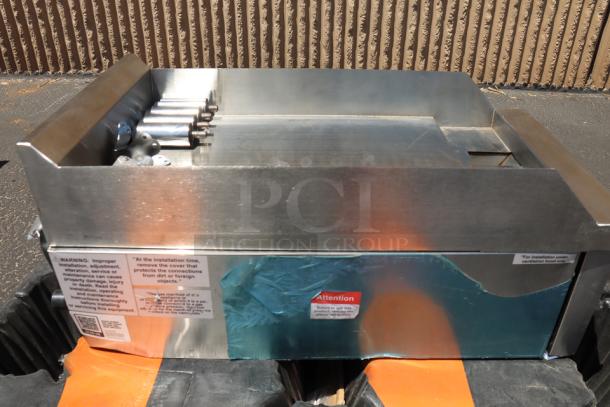 Brand new Avantco CAG-15-MG 15" countertop gas griddle, 30,000 BTU, stainless steel, manual controls, slight imperfections.