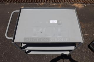 Brand new Lavex 36" x 24" x 35" steel utility cart, model 257LSUC24363. Three tray shelves, fully welded, missing wheels, tag #42.