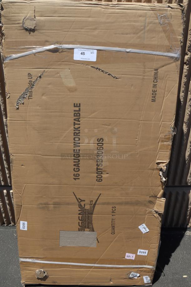 Regency 600TSB3060S work table packaging, 16-gauge stainless steel, 30"x60", includes 4" backsplash, undershelf. Box dented.