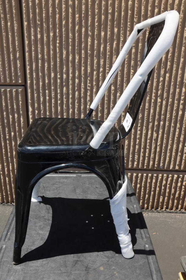 Brand new Lancaster Table & Seating Alloy Onyx Black outdoor cafe chair, model 164CMCAFEBLK, with minor scuffs.