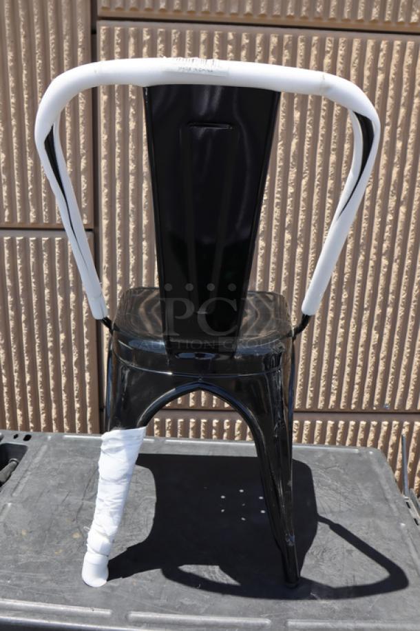 Brand new Lancaster Table & Seating Alloy Onyx Black Outdoor Cafe Chair, model 164CMCAFEBLK, with minor scuffs.