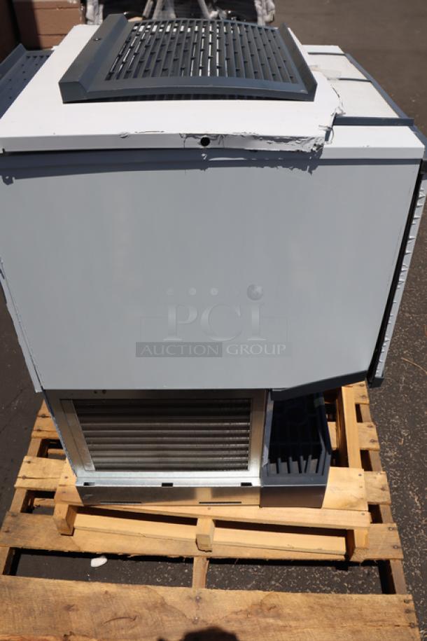 Brand new Scotsman HID525A-1 ice machine, dented metal panels, 25 lb. bin, air-cooled, 115V, on pallet.