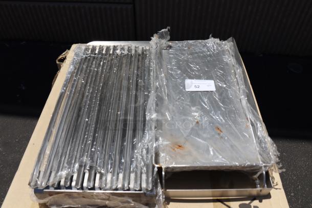Brand new Avantco 177AOGB2427 24"x27"x4" griddle/broiler top, wrapped in plastic; item tag indicates model and quantity.