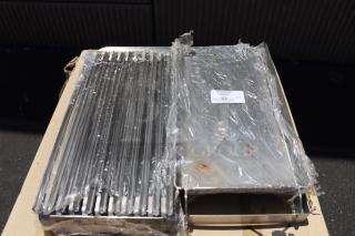 Brand new Avantco 177AOGB2427 24"x27"x4" griddle/broiler top, wrapped in plastic; item tag indicates model and quantity.