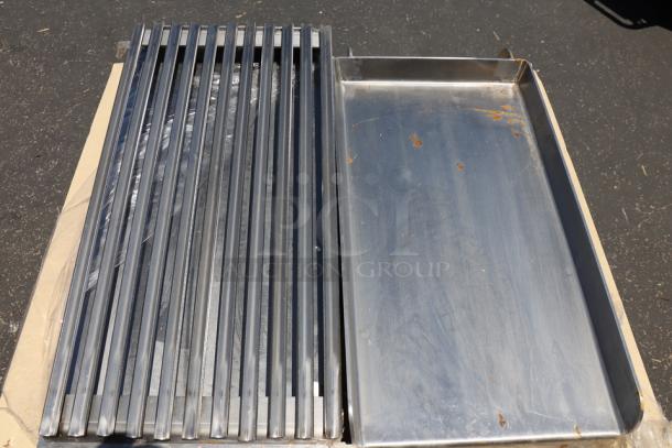 Brand new Avantco 177AOGB2427 24" x 27" x 4" add-on 4 burner griddle/broiler top, stainless steel, no packaging.
