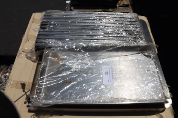 Brand new Avantco 177AOGB2427 4-burner griddle/broiler top, 24"x27"x4", packaged with protective wrap.