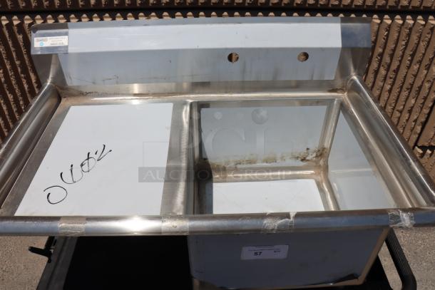 Brand new Steelton 522CS11818LT stainless steel commercial sink, 18" x 18" x 12" bowl, left drainboard, minor dents/scratches.