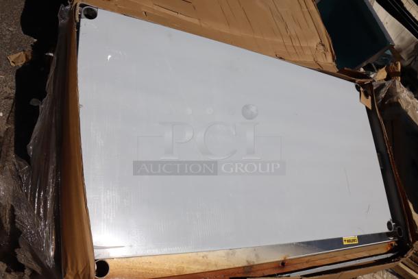 Regency 600TSB3660S stainless steel work table, 36"x60", with 4" backsplash and undershelf. Scratch-n-dent condition.