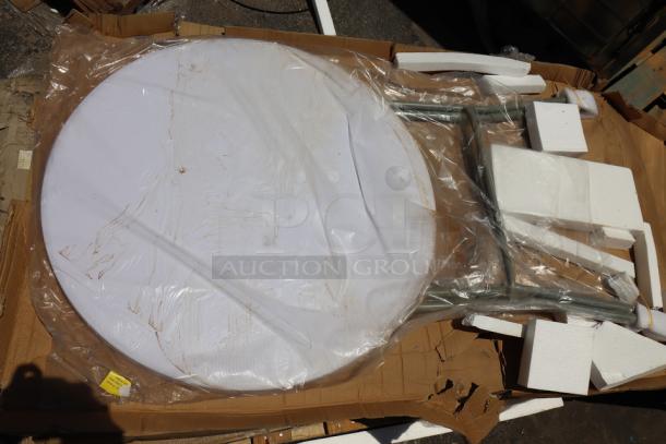Brand new 32" round Lancaster Table & Seating folding table, model 384YCZ32RNDB, in plastic wrap, granite white.