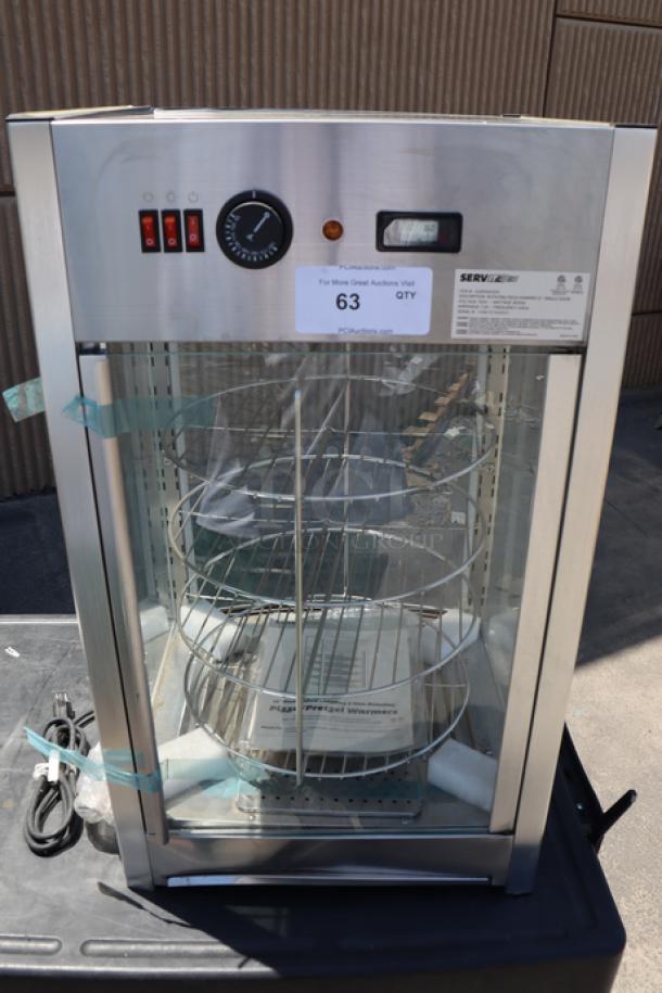ServIt PDW12D1 12" Pizza Warmer, 4-shelf rotating rack, excellent condition, minor dents, glass intact, no packaging.