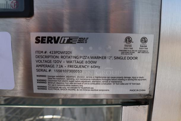 ServIt PDW12D1 12" Pizza Warmer label showing item specs, 120V, 800W, 7.2A. Serial No: 1556107300053. Glass intact, minor denting.