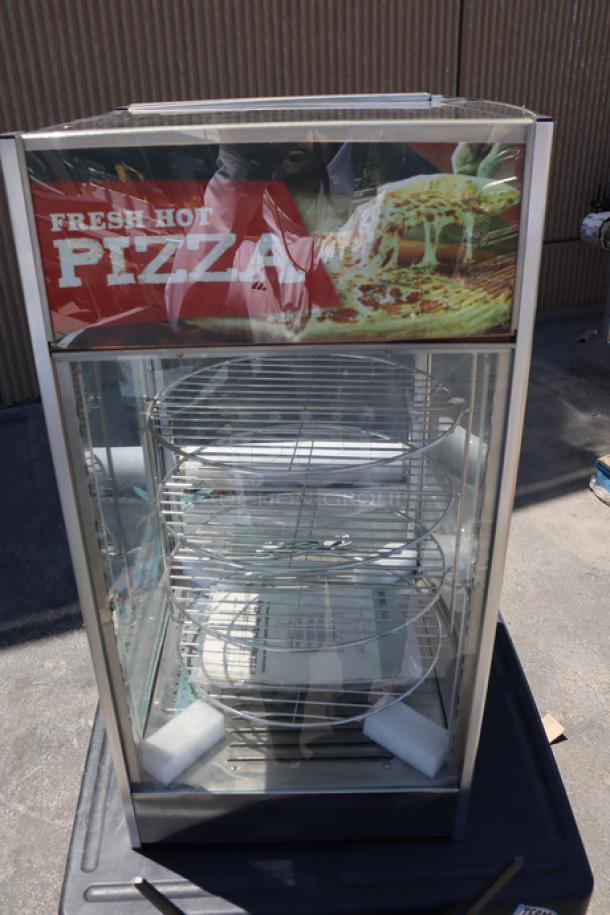 Brand new ServIt PDW12D1 12" pizza warmer with 4-shelf rotating rack, intact glass, minor denting, out of packaging.