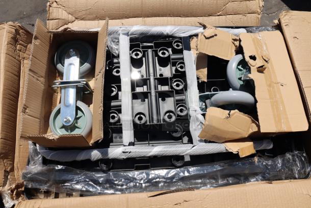 Lavex 36" x 24" platform truck with ergonomic handle, 6" polyurethane casters, 1,200 lbs capacity. Packaging damaged.