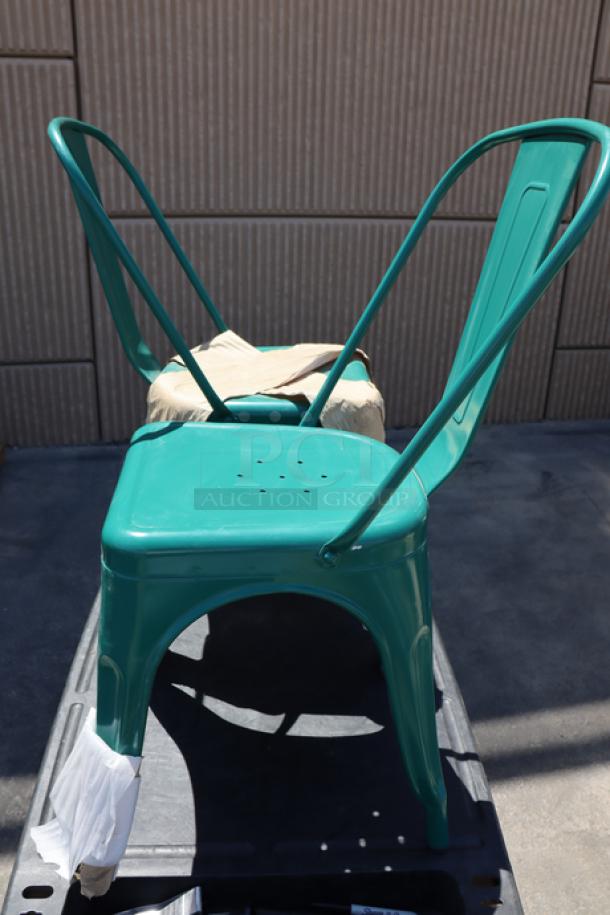 Lancaster Table & Seating turquoise outdoor cafe chair, model 164CMCAFEARC, brand new, shown out of packaging.
