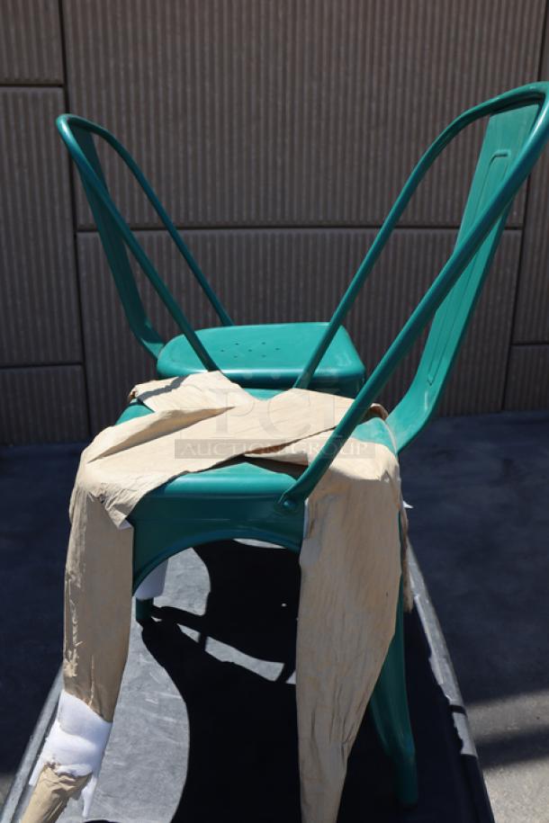 Brand new Lancaster Table & Seating 164CMCAFEARC alloy turquoise outdoor cafe chair, shown out of packaging.
