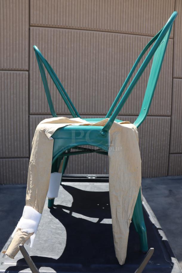 Brand new Lancaster Table & Seating 164CMCAFEARC outdoor cafe chair in turquoise. Alloy construction; partially wrapped.